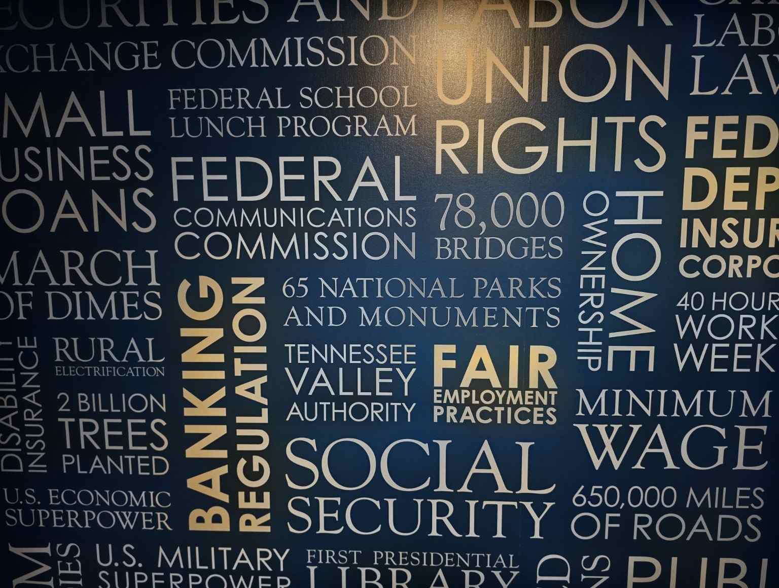 Museum display showing New Deal including Social Security and public works.
