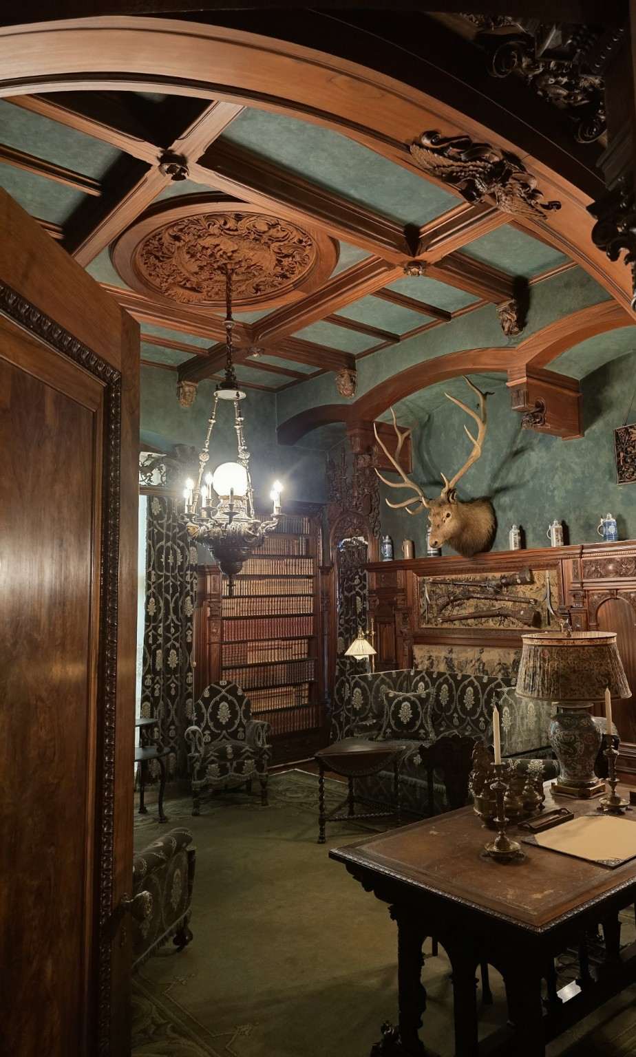 Ornate wood and green-paneled ceiling inside Vanderbilt Mansion in Hyde Park.